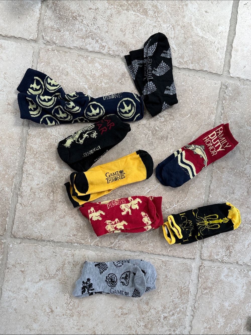 Game of Thrones assorted socks unisex worn , but lots of life left in them.